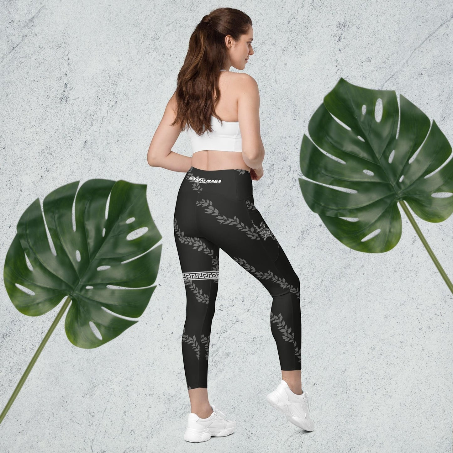 Immortal Krav Maga black high-waisted leggings with pockets, featuring a laurel wreath and Greek key pattern.