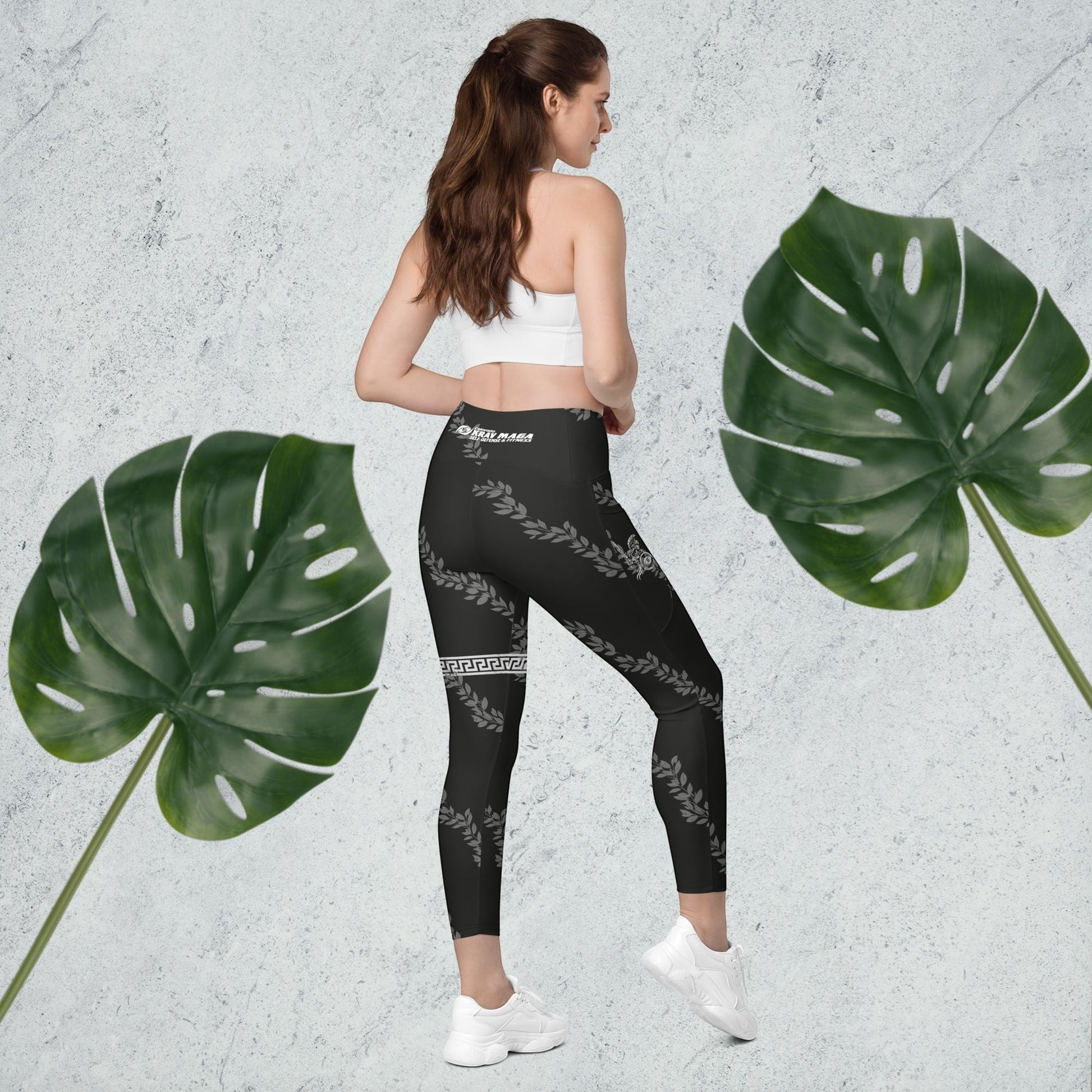 Immortal Krav Maga black high-waisted leggings with pockets, featuring a laurel wreath and Greek key pattern.