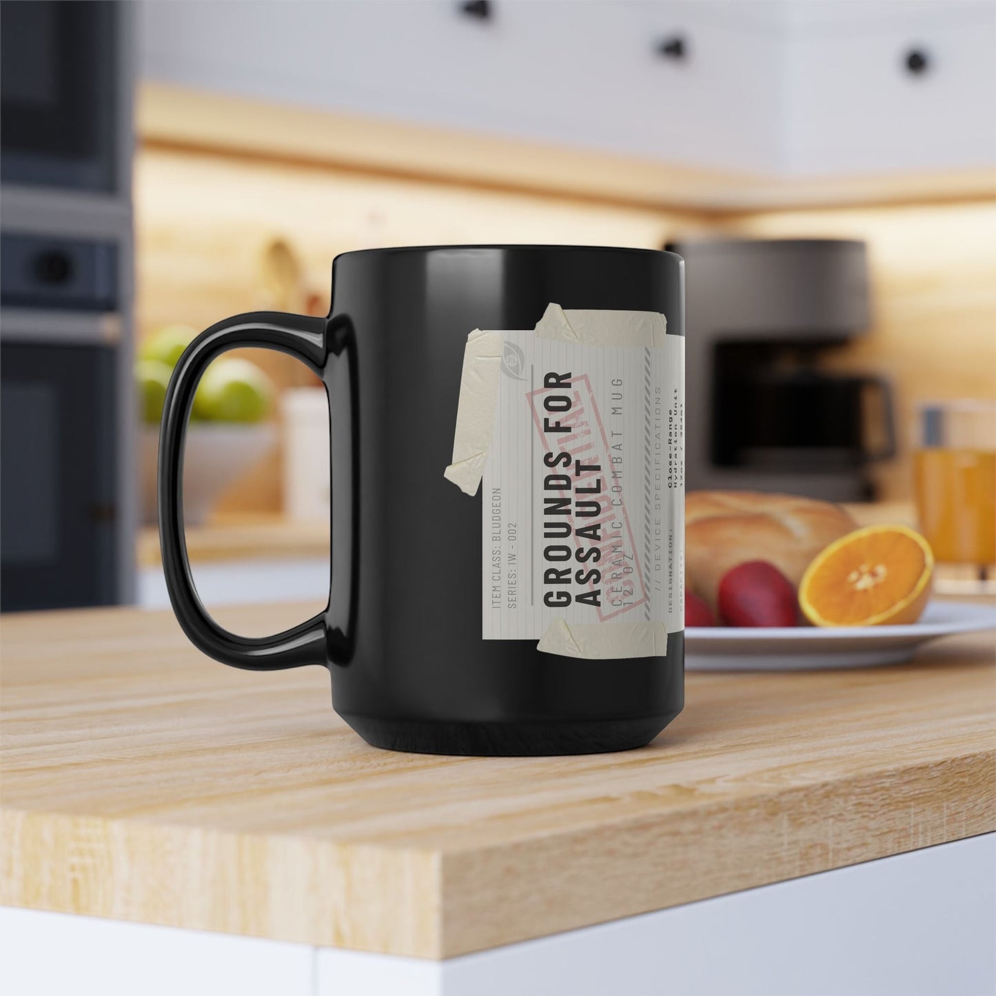Immortal Krav Maga black ceramic 12oz combat mug with "GROUNDS FOR ASSAULT" label and ergonomic C-shaped handle.