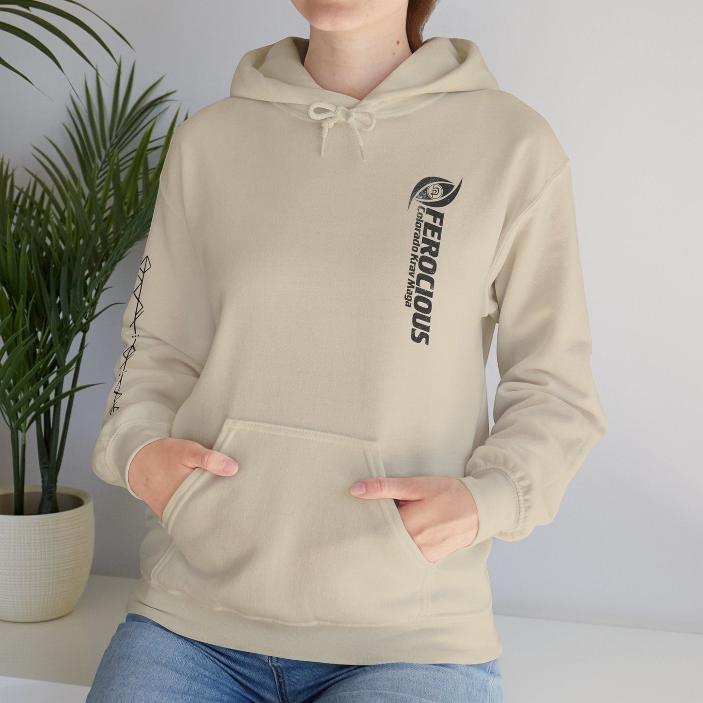 Immortal Krav Maga beige cotton-poly blend hoodie with "Ferocious" graphic on chest and sleeve detail.