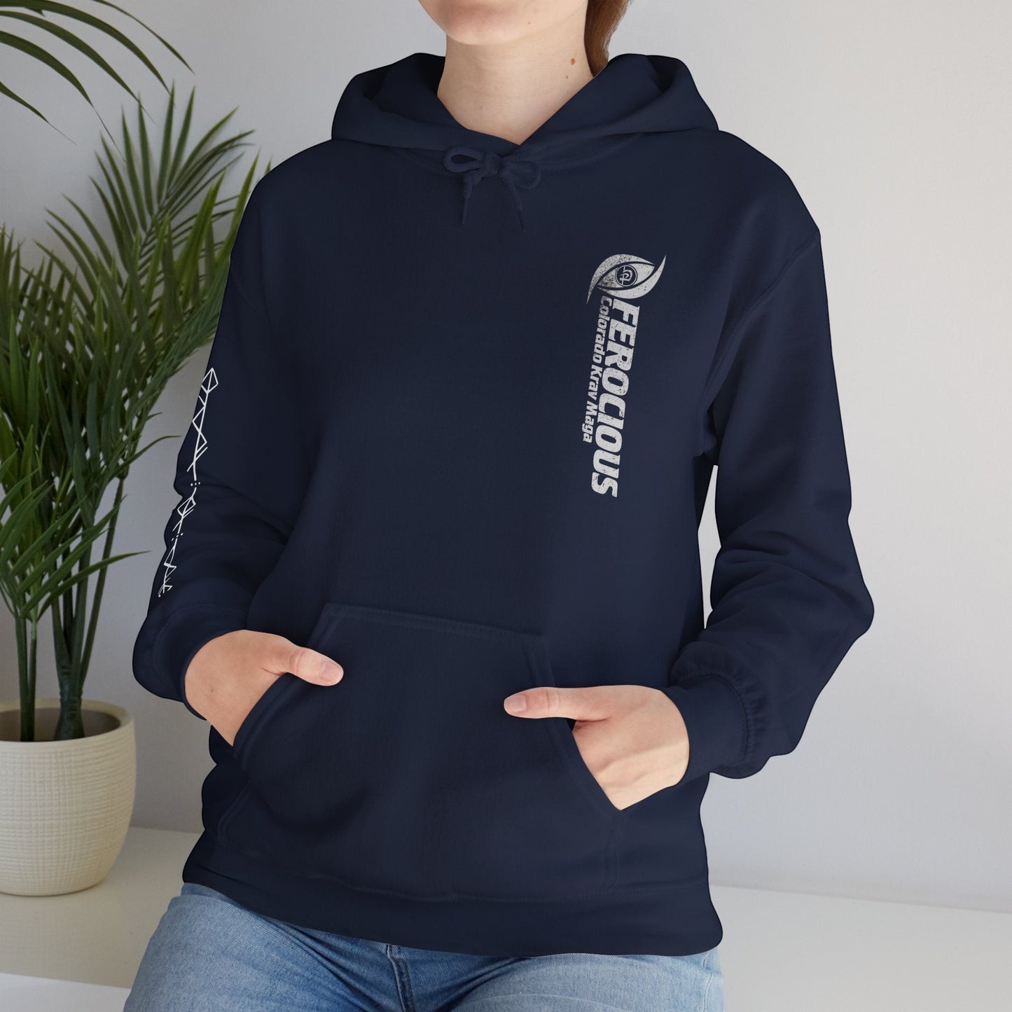 Immortal Krav Maga navy blue cotton-poly blend hoodie with "FEROCIOUS Colorado Krav Maga" graphic on chest and geometric pattern on sleeve.